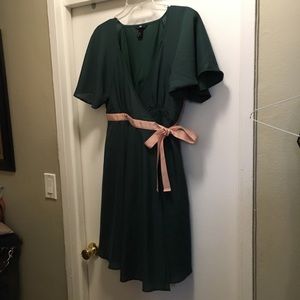 Green wrap dress with pink bow